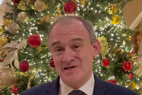 Ed Davey in front of a Christmas tree