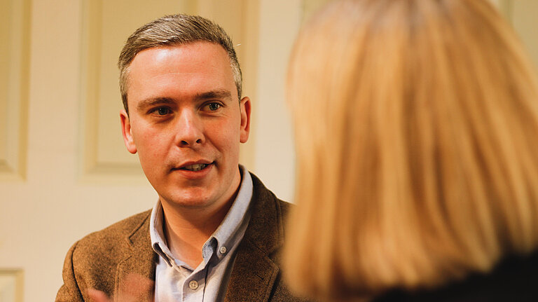 David speaking with a voter