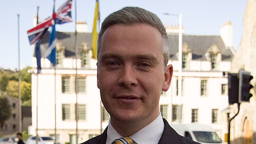 David at Parliament with flags